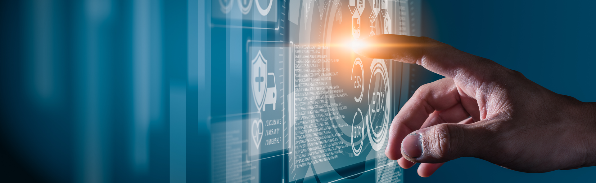 Una mano toca la pantalla de un ordenador para acceder a sistemas digitales.