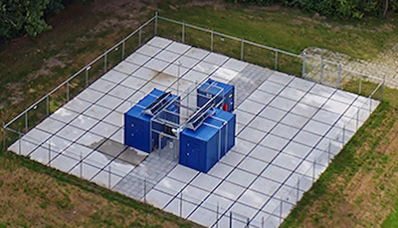 Electrolyser units in these blue containers are producing high purity green hydrogen gas for heating homes in a nearby apartment block in Rotterdam, Netherlands